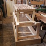 Early stages of assembly: Plinth, building frame with soundboard on top